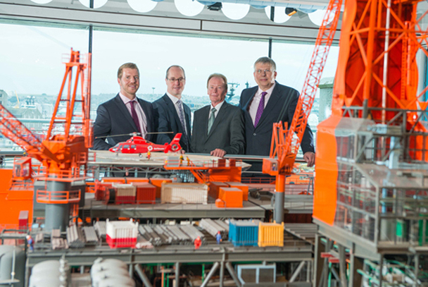Donald Martin, decommissioning topsides delivery team leader at CNRI; Andy Clucas, senior project manager at Aker Solutions; Mike Buckingham, vice president technical at Aker Solutions; and Roy Aspden, decommissioning project manager at CNRI. Picture taken beside the Murchison platform model at the Aberdeen Maritime Museum. 